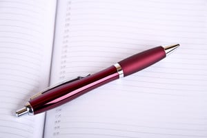 a pen on a planner
