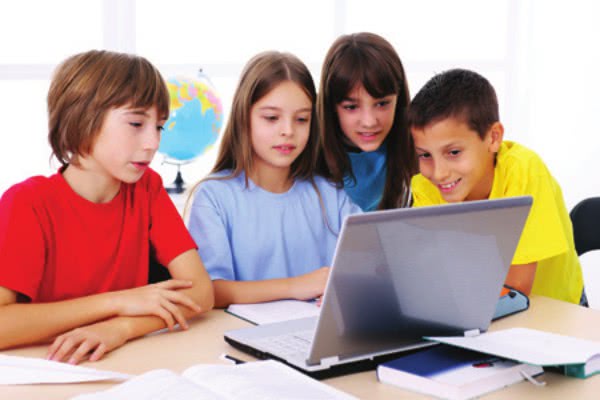 Children looking at a computer